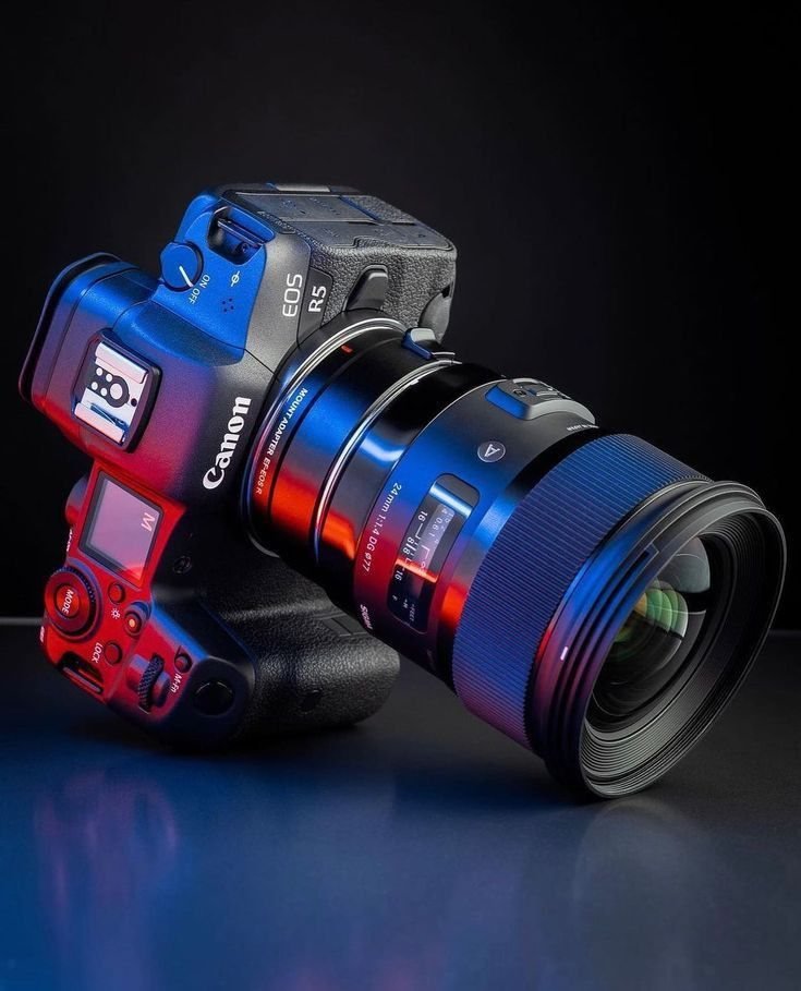 Canon EOS R5 camera with a wide lens in blue and red studio light